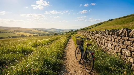 Bicycle on dirt path next to stone wall